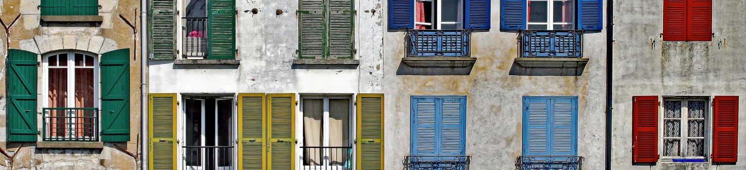 Photo: Colorful windows in Bords de la Nive, Bayonne, FranceBords de la Nive, Bayonne, France