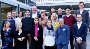 Photo: Group photo of the organizers and attendees of the workshop titled "Funding the UN system" in front of the German Institute of Development and Sustainability (IDOS).