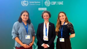 Photo: Aparajita Banerjee, Anna-Katharina Hornidge, Alexia Faus Onbargi in front of a wall at the United Nations Climate Change Conference (COP28) in Dubai 2023