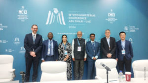 Group picture: 7 people of different nationalities at the Trade and Sustainability Hub, which took place from 27-28 February in Abu Dhabi as part of the 13th Ministerial Conference of the World Trade Organization. On the left: Dr. Axel Berger, Deputy Director of IDOS.