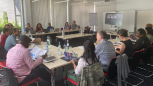 Photo:  The  interdisciplinary group of scholars from Bolivia, Colombia, Ghana, Germany and Indonesia sitting at a table, identifying commonalities and differences between local, regional and global notions of sustainability