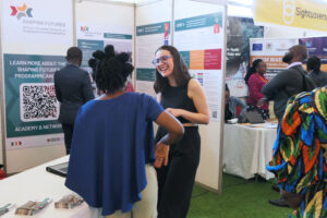 Photo: One of the poster presentations in a Shaping Futures booth at the conference’s knowledge fair.