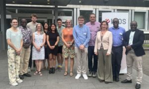 Group photo: Participants of the BioCAM4 workshop stand in front of IDOS.