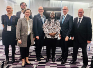 Caption for group photo: “From left: Patricia Kramarz (Save the Children Germany), Christoph Strupat (IDOS), Anna-Katharina Hornidge (IDOS), Florian Westphal (Save the Children Germany), Sarah Kosgei (Amref Africa), Niels Annen (State Secretary, BMZ), Rüdiger Krech (Director, WHO)”