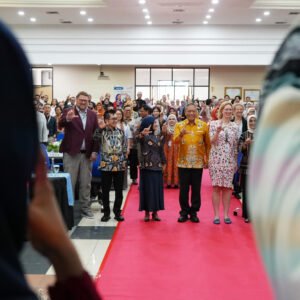 Photo: Participants at the MGG conference taking part in a team-building exercise.