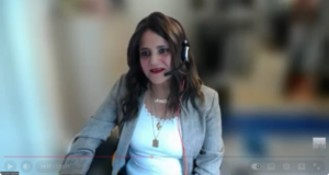 Photo of mirah El-Haddad with a headset