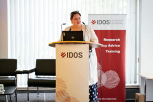 Clara Labertino speaking on the conference